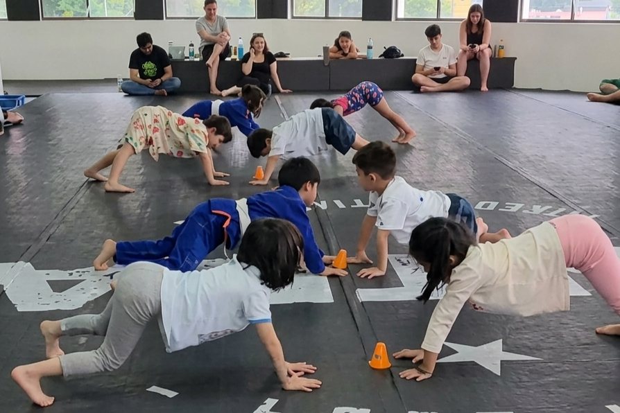 Kids class doing push-ups together during a Central MMA class